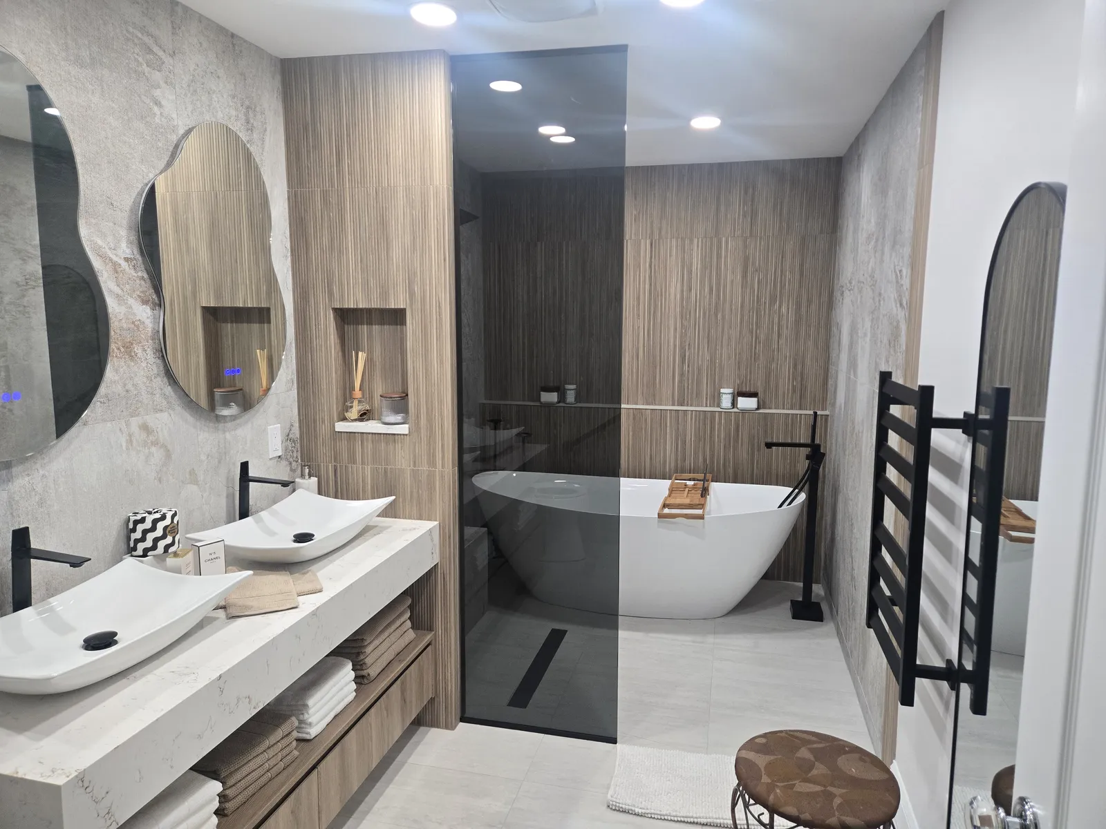 Full bathroom with a freestanding tub and double vessel vanity