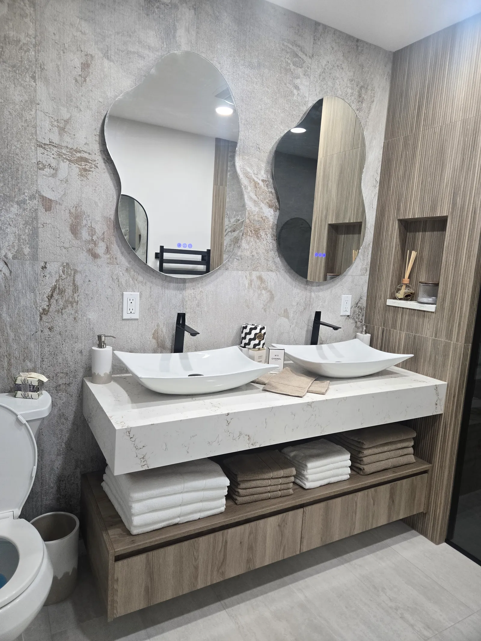 Floating double vanity with stone wall panels