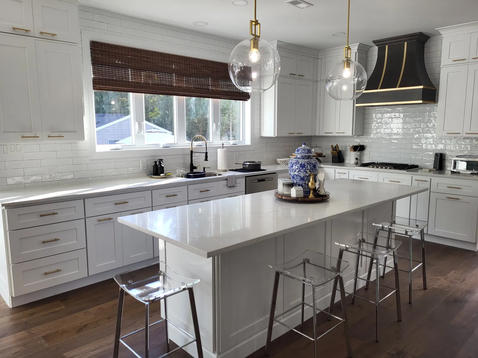 Classic white kitchen with glass upper cabinets