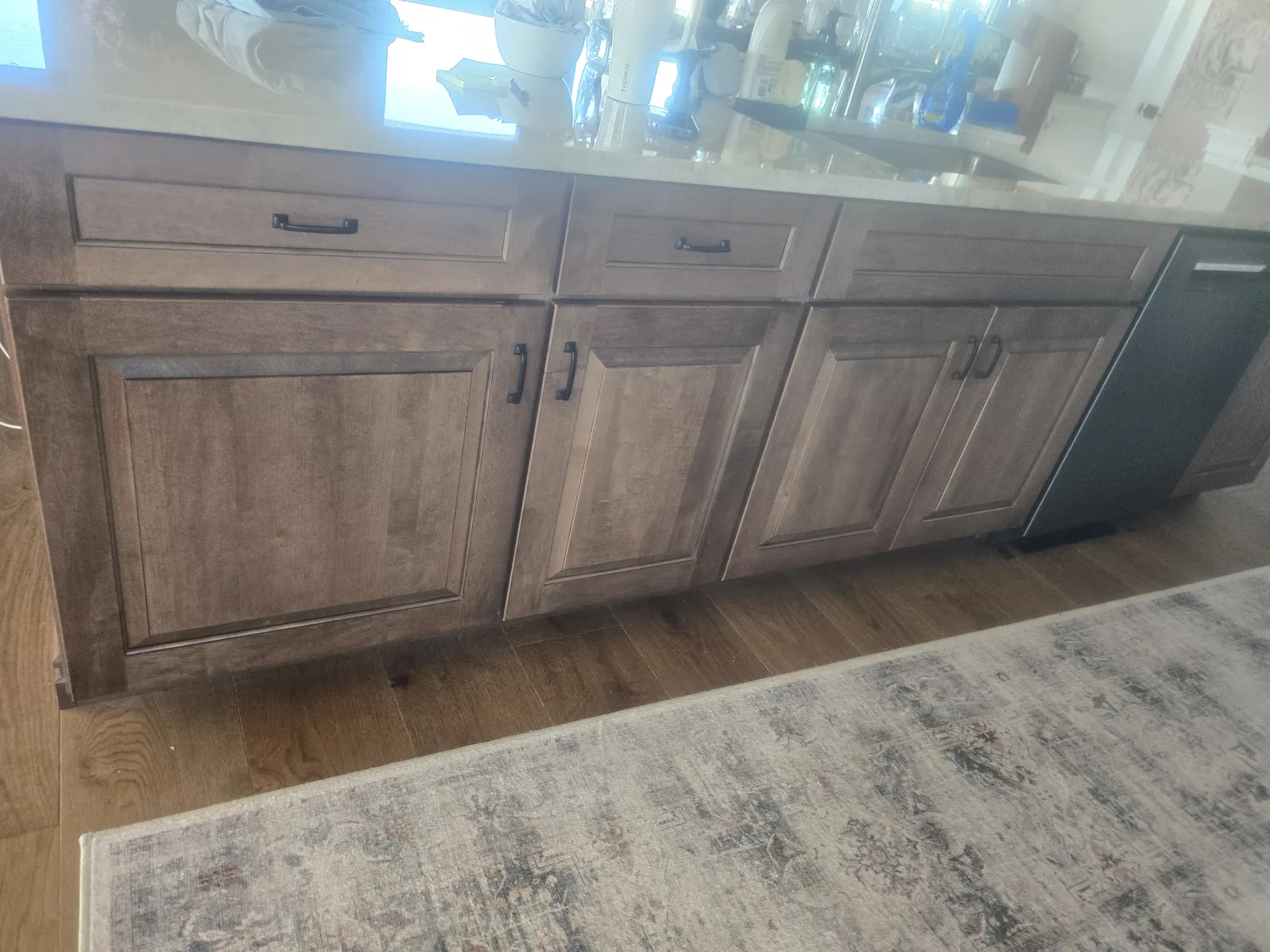 Stained island and white perimeter cabinets, another angle