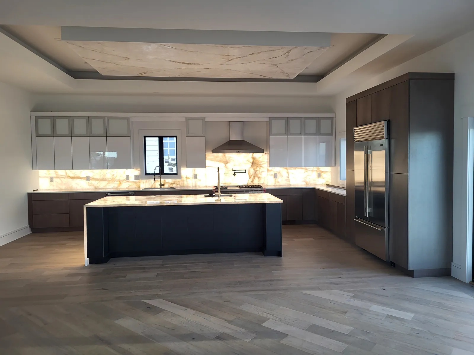 Black island and walnut tall cabinets, another angle