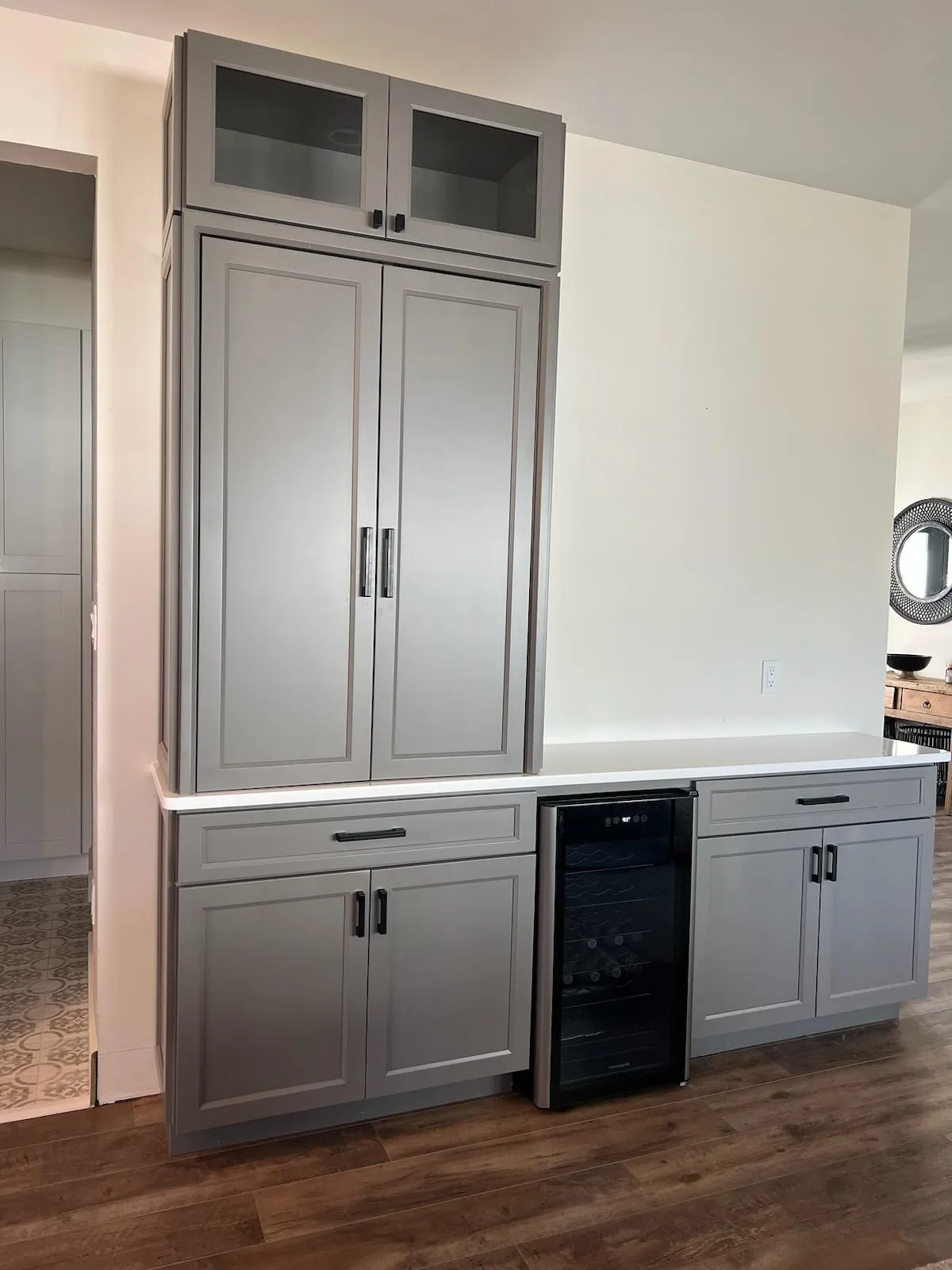 Grey larder cabinets with furniture style doors